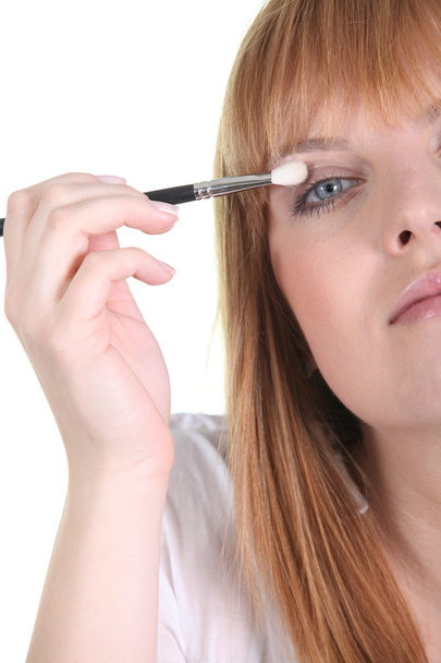 Woman applying eyeshadow - Zdjęcie, obraz