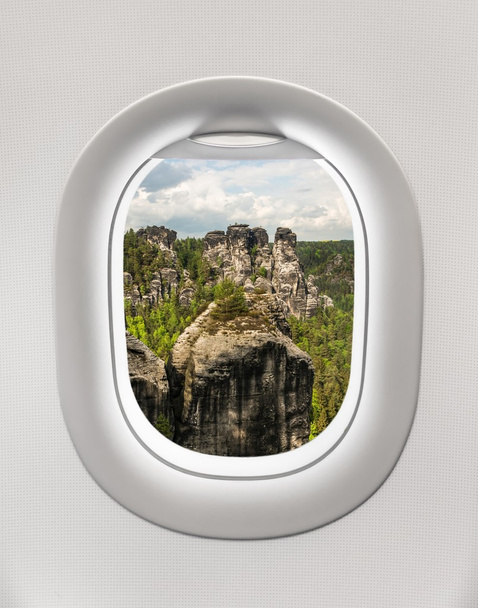 Looking out the window of a plane to the rocks, Germany - Photo, Image