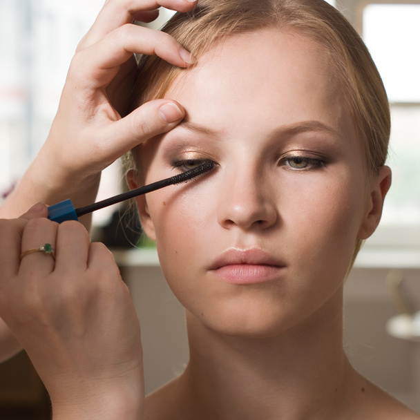 Make-up artist applying liquid eyeliner with brush - Photo, Image