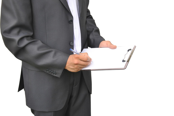 Men in dark suit writes on clipboard with pen isolated - Foto, Imagem