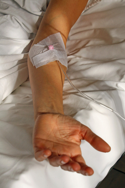 Arm of the patient with a patch for the drip - Photo, Image