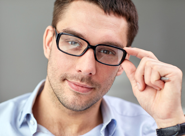 portrait of businessman in eyeglasses at office - Фото, зображення
