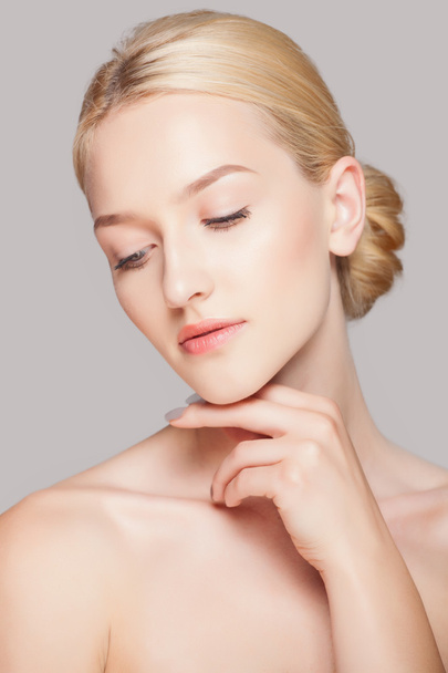Fashion woman with beautiful face - isolated on white. Skin care concept. - 写真・画像
