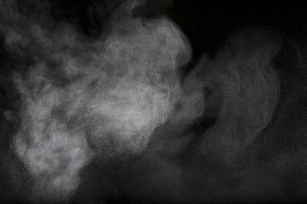 powder cloud against dark background - Photo, Image