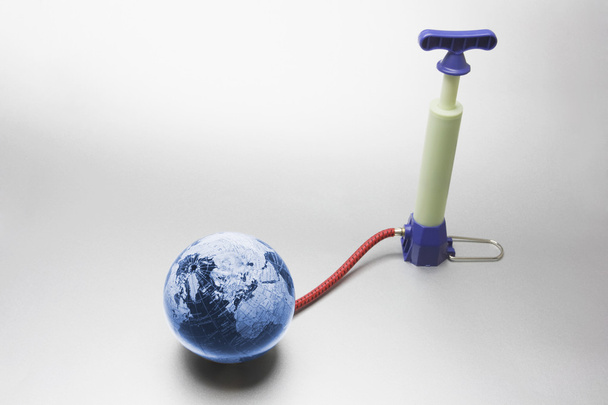 Miniature Pump Attached to Globe - Fotoğraf, Görsel