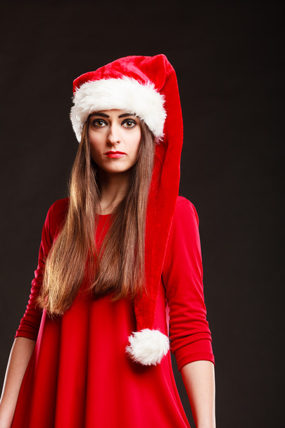 Woman wearing santa claus hat posing - Foto, Imagem