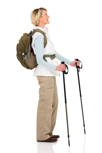Senior woman with backpack and hiking poles - Photo, image