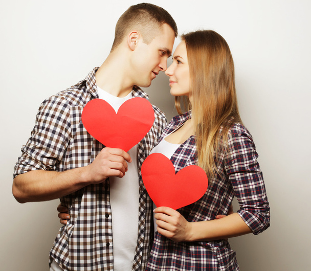  Happy couple in love holding red heart. - Φωτογραφία, εικόνα