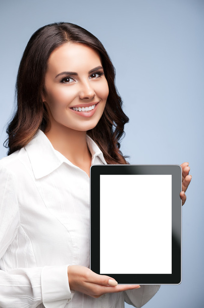 Businesswoman showing blank tablet pc, on grey  - Фото, изображение