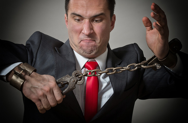 Chained businessman - Foto, Bild