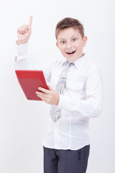 Portrait of teen boy with calculator on white background - Фото, зображення