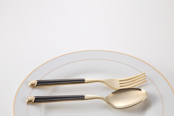 plate with fork and spoon - Фото, зображення