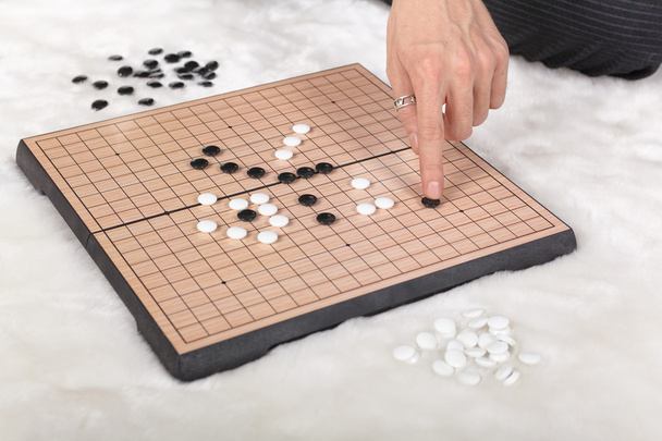 Boardgame reversi game in action - Photo, Image