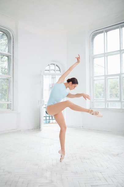 young modern ballet dancer posing on white background - Фото, зображення