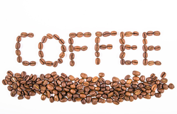 Composition of roasted coffee beans close-up on a white backgrou - Valokuva, kuva