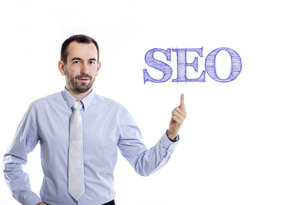 SEO - Young businessman with blue text - Foto, Bild