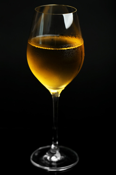 Glass of wine on dark background - Foto, Imagen