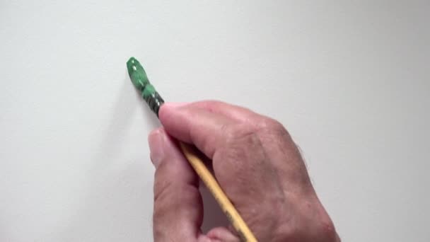 Menschenhandschrift "Ja" mit grüner Gouache - Filmmaterial, Video