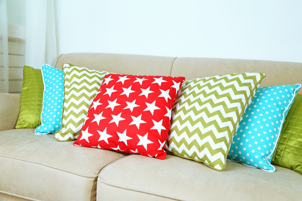 Colorful pillows on sofa - Фото, изображение