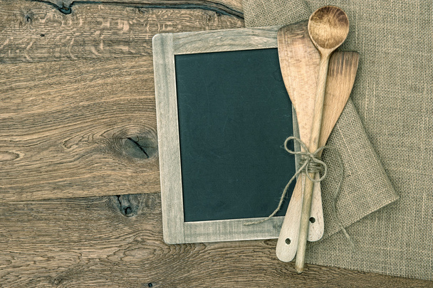 Retro kitchen utensils and vintage blackboard on wooden backgrou - Φωτογραφία, εικόνα