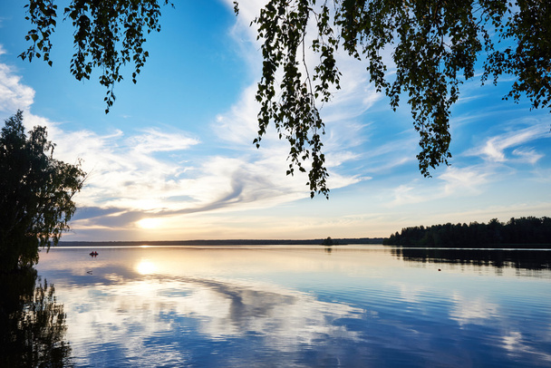 Evening fishing at sunset on lake - Valokuva, kuva