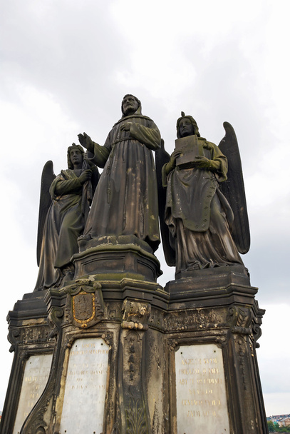 St. Francis of Assisi statue on the Charles Bridge in Prague - Zdjęcie, obraz