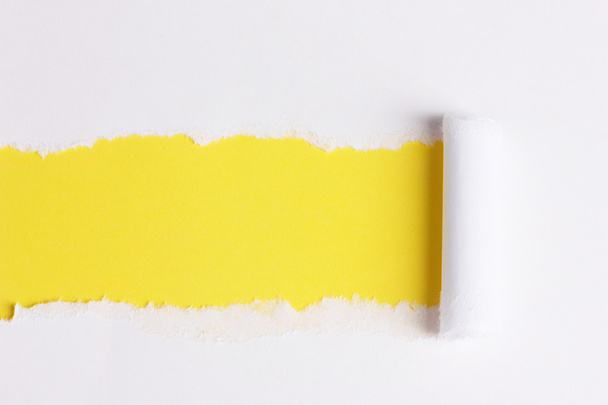 Torn paper with yellow background - Photo, image