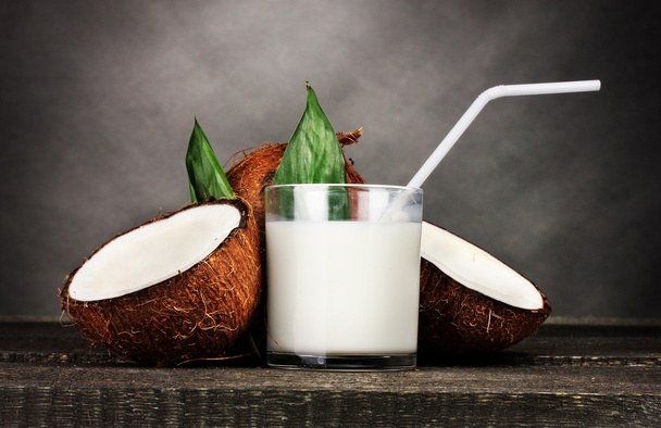 Coconut milk and coconut on grey - Valokuva, kuva