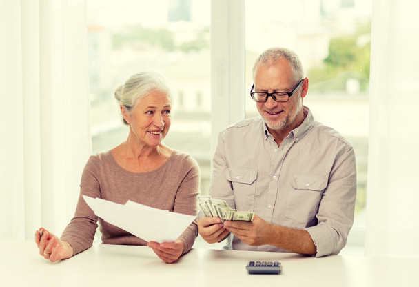 senior couple with money and calculator at home - Photo, Image