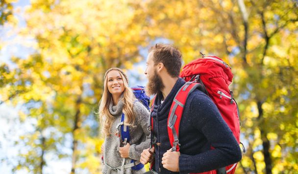 smiling couple with backpacks hiking - Foto, immagini