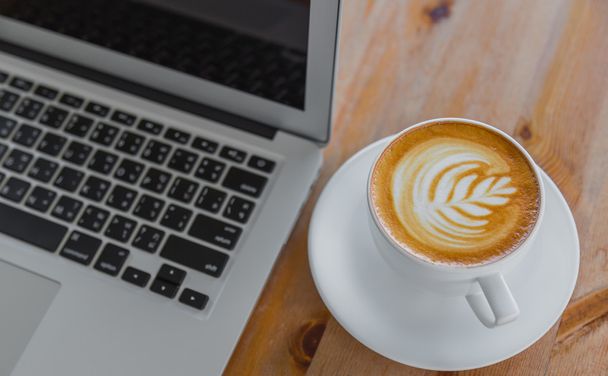 Laptop with coffee cup - Foto, Imagen
