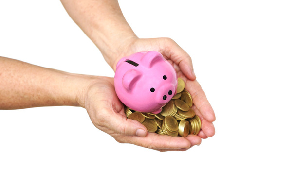 gouden munten met een roze piggy bank - Foto, afbeelding