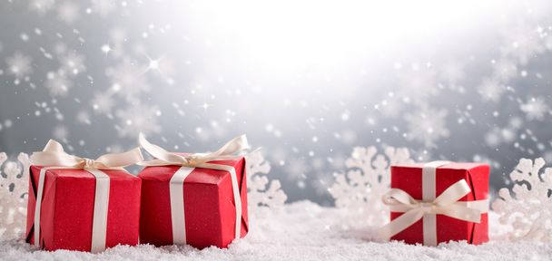 Christmas gift box on snow - 写真・画像
