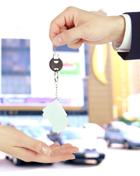 Keys in hand on blurred background - Photo, Image