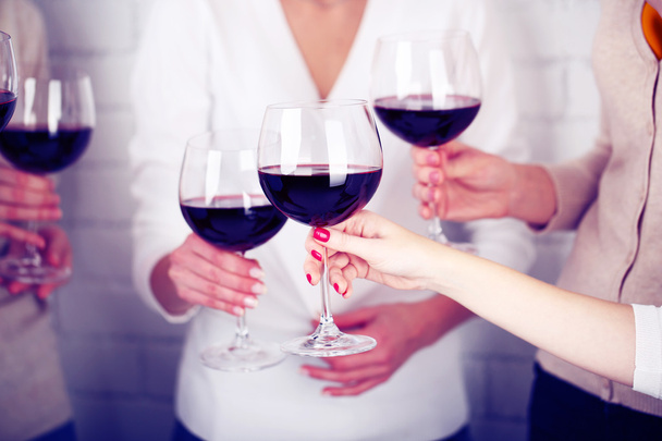 Female hands with glasses of wine - Photo, image
