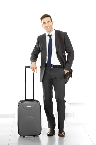 Man holding suitcase  - Foto, afbeelding