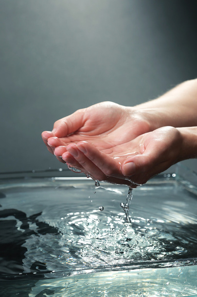 Female hands with water splashing - Фото, зображення