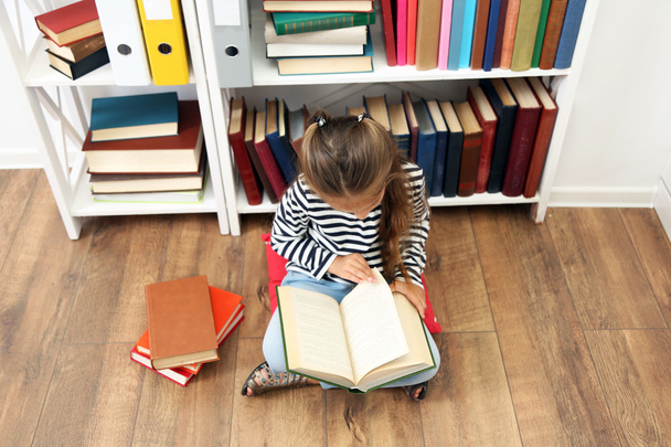 Beautiful little girl with books - Фото, зображення