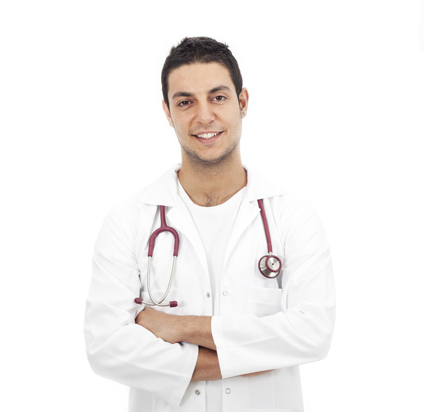 Young doctor man standing on white - Foto, imagen
