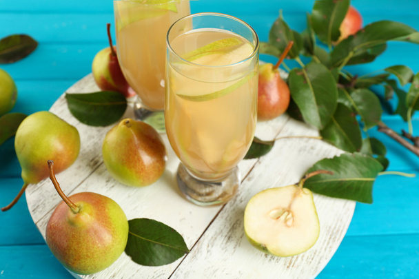 Fresh pear juice with fruit on table close up - Photo, image