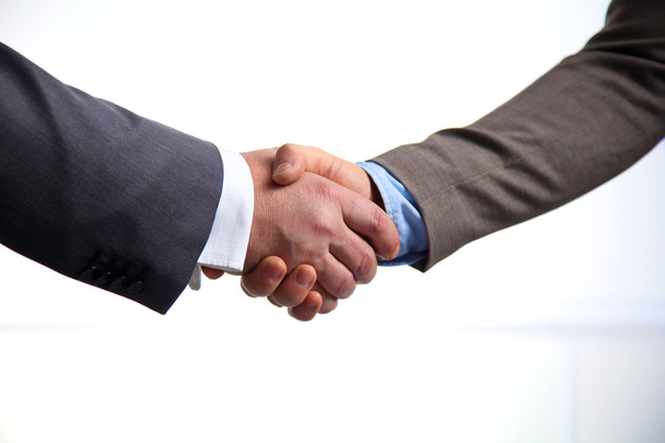 Business meeting at the table shaking hands conclusion of the contract - Photo, Image