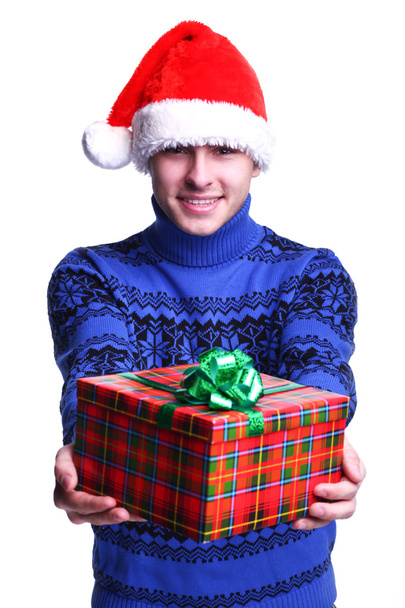 Man in red hat with gift - Foto, imagen