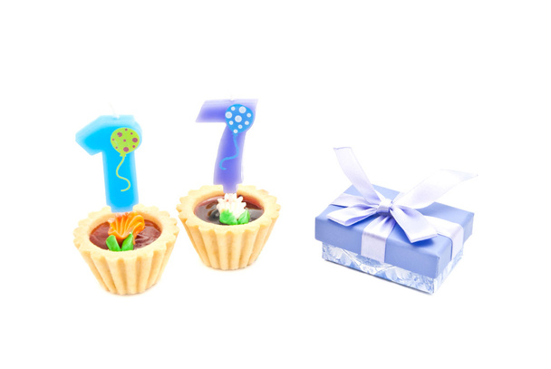 cakes with seventeen years birthday candles and gift  - Φωτογραφία, εικόνα