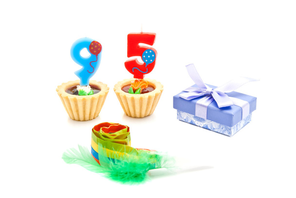 cakes with ninety five years birthday candles, whistle and gift  - Фото, зображення