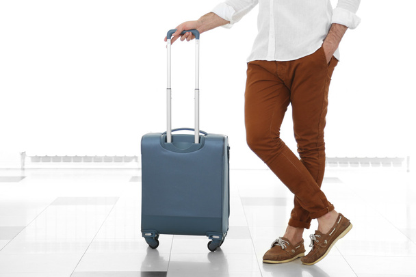 Man holding suitcase   - 写真・画像
