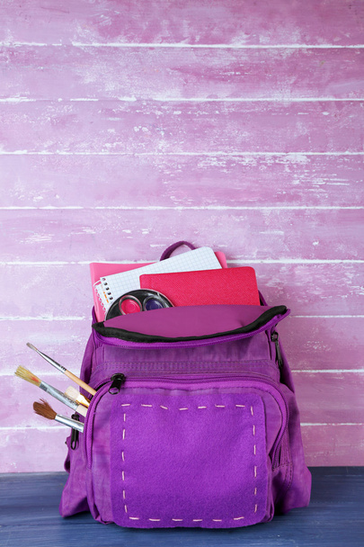 School backpack on wooden background - Photo, Image