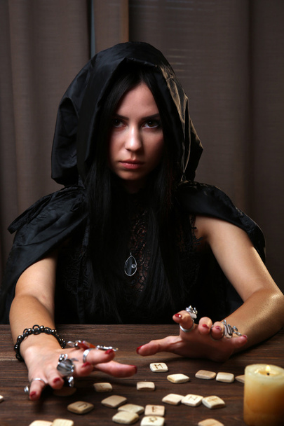 Witch - fortune teller on dark background - Фото, изображение