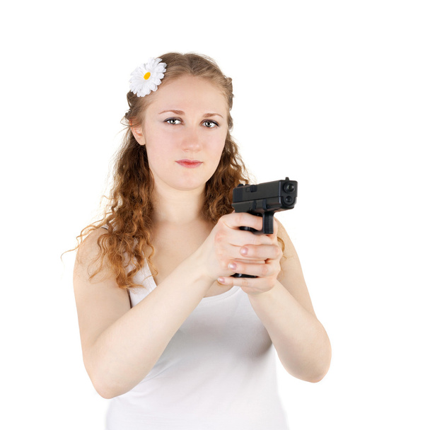 Pretty young girl with pistol - Photo, image