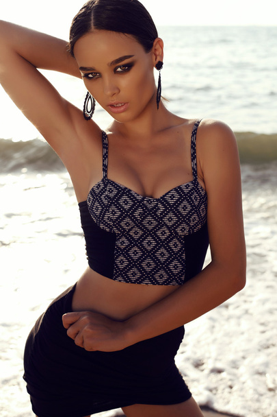 sexy girl with dark hair and tanned skin posing on beach  - Φωτογραφία, εικόνα