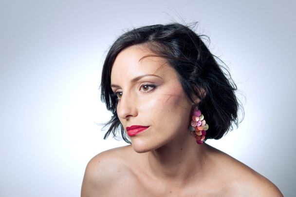 Woman wearing earrings - Fotografie, Obrázek